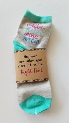 two pairs of socks that say, may your new school year start off on the right foot