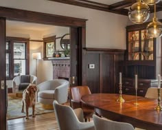 a dog is standing in the middle of a large dining room with wood paneling