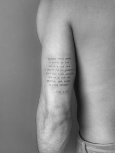 the back of a man's left arm with a poem written in black ink on it