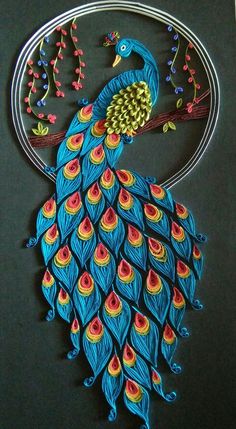 the peacock is made out of metal and has colorful feathers on it's tail