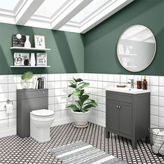 a bathroom with green walls and white tiles on the floor is pictured in this image