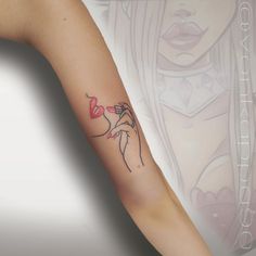 a woman with a tattoo on her arm holding a flower in one hand and a rose in the other