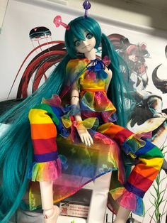 a colorful doll sitting on top of a table