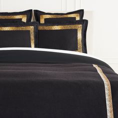 black and gold bedding with white trim