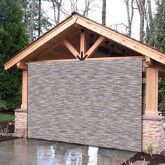 an outdoor pavilion made out of bricks and wood