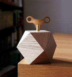 a wooden object on top of a table