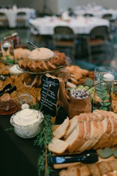 an assortment of breads and other food items on a table