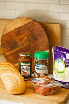 bread, butter, and other ingredients on a cutting board