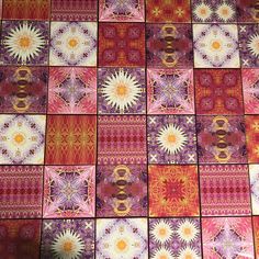 colorful tiles with different designs on them