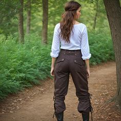 Set sail on a grand adventure with our Women Brown Pirate Pants, designed to evoke the rugged elegance of medieval and Viking eras. These trousers are meticulously crafted to offer both comfort and authenticity, making them perfect for renaissance fairs, LARP (Live Action Role Play) events, and fantasy cosplay. The rich brown fabric and high-waisted fit provide a flattering silhouette, while the durable construction ensures they withstand the rigors of any adventure, whether on land or at sea. Ideal for portraying a daring pirate, a noble Viking, or a humble peasant, these pants are a versatile addition to any costume collection. Embrace the spirit of the past with these Renaissance Larp Cosplay pants, which also seamlessly blend into steampunk and fantasy-themed outfits. The detailed craf Ren Faire Women Pants, Medieval Clothing Women Pants, Ren Fair Pants, Forest Themed Outfit, Pirate Outfit Female Modern, Ren Faire Pants, Pirate Academia, Adventure Clothes Fantasy, Viking Trousers