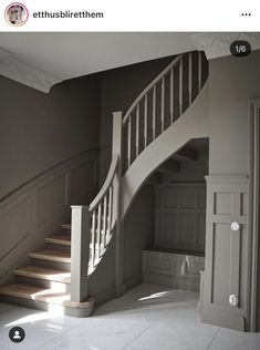 an empty room with stairs leading up to the second floor and another door on the other side