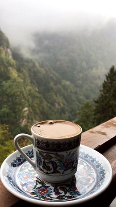 a cup of coffee sitting on top of a saucer