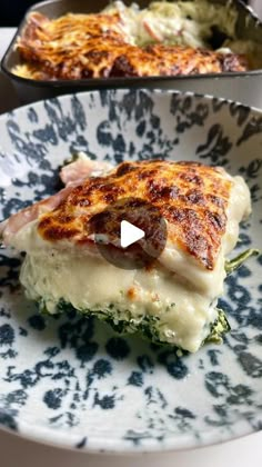 a close up of a plate of food with broccoli and cheese on it