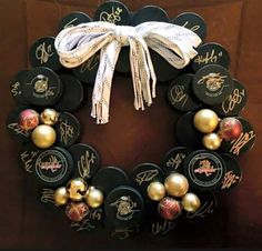 a wreath made out of hockey pucks and ornaments