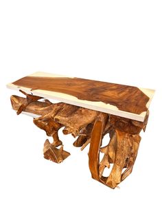 a piece of wood that is sitting on top of a wooden table and has been turned into a bench