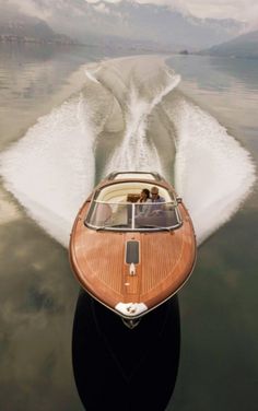 a motor boat is speeding across the water