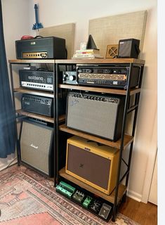 an assortment of amps are stacked on top of each other