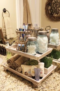 two tiered trays holding jars and towels