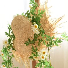 Handcrafted natural straw hat with silk-like flowers and vines, spring-like daisies and green leaves complement each other to enhance the authenticity.(This product needs to be compressed and transported with artificial flowers and straw hats. After unpacking, you can refer to the pictures to organize and restore them. Due to the blooming conditions of the artificial flowers, the height and width of the product may vary slightly.) Handmade Straw Hat For Spring Country Events, Handmade Straw Hat For Country Events In Spring, Handmade Bohemian Straw Hat For Spring, Bohemian Natural Straw Hat For Spring, Adjustable Palm Leaf Straw Hat For Spring, Bohemian Palm Leaf Straw Hat For Spring, Bohemian Natural Straw Hat For Garden Party, Spring Woven Palm Leaf Hat, Bohemian Style Palm Leaf Sun Hat For Spring