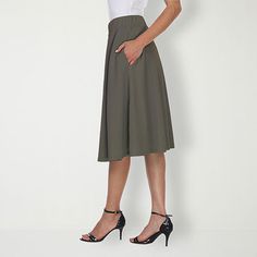 Strut or twirl with confidence in this light and breezy flared skirt. Perfect for keeping cool on a hot summer's day or for adding a touch of style whether you're off to work or a night on the town, this polyester and spandex skirt is as versatile as it is alluring.Front Style: Flat FrontFeatures: Stretch FabricClosure Type: Full ElasticPockets: 2 Side Slip PocketsRise: Mid RiseApparel Length: 23 InchesFiber Content: 95% Polyester, 5% SpandexFabric Description: KnitLining: UnlinedSkirt Length: Flattering Spring Midi Skirt, Flowy Pleated Full Skirt, Spring Pleated Waist Flowy Skirt Bottoms, Pleated Flared Mini Skirt For Day Out, Summer Full Skirt Bottoms With Pleated Waist, Spring Pleated Waist Flowy Skirt, Summer Pleated Full Mini Skirt, Fitted A-line Summer Skirt, Flared Gathered Skort For Spring