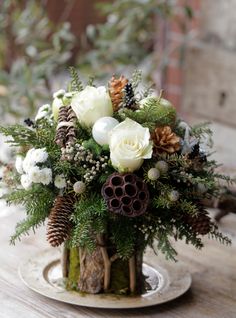 a vase filled with white flowers on top of a wooden table next to an instagram