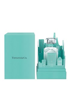 tiffany & co perfume bottle in blue box with cityscape on the front and bottom