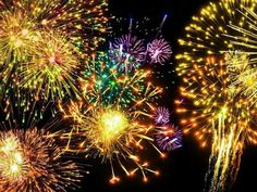 fireworks are lit up in the night sky with bright colors and sparkles on them