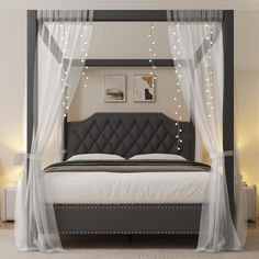 a bed with white curtains and lights on the headboard is in a room that has carpeted flooring