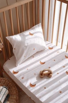 Create a dreamy nursery with our Organic Cotton Satin Fitted Baby Sheets, featuring a whimsical sky, star, and moon pattern. These soft and durable crib sheets, made from organic cotton satin, are perfect for your toddler's comfort. As unique baby gifts, they offer both style and practicality, making bedtime a celestial experience for your little one. ✨ Product Features ✨ Made from 100% Organic Cotton Satin fabric Crib & Twin Size Sheet set includes a baby pillowcase, varying with sheet size Ful Neutral Toddler Bedding, English Woodland, Bedding Toddler, Single Bedding Sets, Baby Duvet, Baby Pillow Case, Toddler Bedding, Baby Sheets, Toddler Bed Set