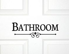 a bathroom door with the word bath room on it