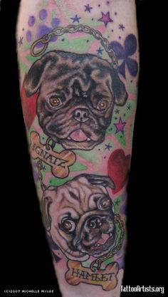 a tattoo with two dogs on it