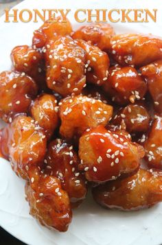 honey chicken on a white plate with sesame seeds