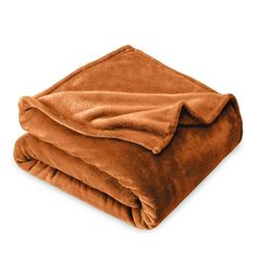 two blankets folded on top of each other, one is brown and the other is tan