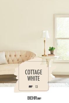 a living room filled with furniture and a white sign above it that says cottage white