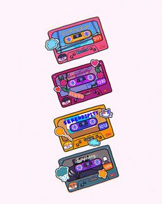 four different colored cassettes sitting on top of each other