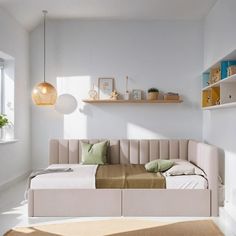 a living room with a couch and shelves on the wall