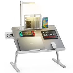 a computer desk with various electronics on it