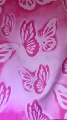 pink and white butterfly print fabric with large, thin butterflies on the back of it