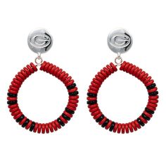 Looking for a unique way to show your Georgia Bulldogs fan credentials on game day? Now you can make a bold statement about your school spirit with these Raya earrings! Their eye-catching design is inspired by your favorite team's iconic logo and colors, letting everyone know you're a proud supporter of the Georgia Bulldogs. Officially licensed Earring measures approx. 1.5" with a drop length of approx. 2.25" Imported Material: 45% Plastic/40% Zinc/15% Steel Charm measures approx. .50" in diamet Street Accessories, College Game Days, Oklahoma Sooners, Iconic Logo, Georgia Bulldogs, School Spirit, Hand Beading, Black Rings, Silver Watch