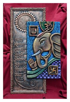 an elephant is depicted on a metal plaque