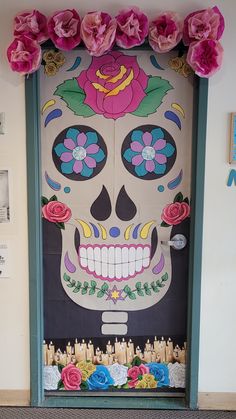 a door decorated with flowers and a sugar skull