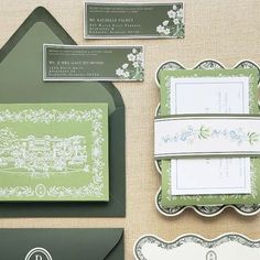 the wedding stationery is green and white