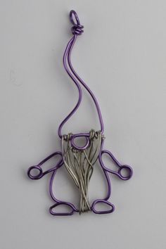 a piece of art that looks like some kind of wire with scissors attached to it