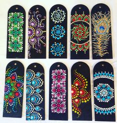 six hand painted tags with designs on them