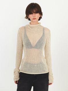 This is a modern and casual knit top by DIAGONAL that is made out of high quality and sturdy fabric. With unique design detail and trendy mood, you can style it for your clean and casual daily outfit.- Natural rolled neckline, cuffs, and hem- Sheer and light knit fabric- High neckline detail Neutral Knit Long Sleeve Tops, Chic Fine Knit Top, Fitted Textured Knit Beige Tops, Chic Textured Knit Fitted Top, Cream Fine Knit Tops For Work, Cream Fine Knit Tops For Layering, Chic Fitted Fine Knit Top, Beige Stretch Knit Top For Work, Modern Turtleneck Top For Layering