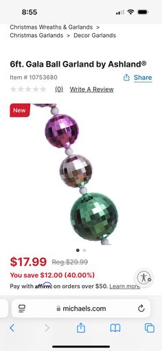 a cell phone with an ad for christmas balls on it and the text get gaia ball garland by ashand