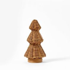 a small wicker christmas tree on a white background