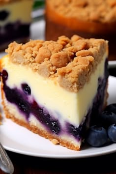 a piece of blueberry cheesecake on a white plate