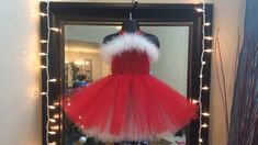 This Christmas inspired dress is made from a red 6" stretch crochet bodice, with a 10" red tulle skirt with a white tulle underskirt and white fur detail. PLEASE READ FULL DESCRIPTION BEFORE ORDERING  Thanks for choosing Danni Does It! When putting on your baby's costume, simply undo the bow of the straps so your baby can easily step into the dress, & tie the straps to the desired length for a halter. In addition, the bodice is VERY stretchy & durable so don't be afraid to do any needed expanding to achieve the perfect fit. Each dress is made once the order is received. Each design may not look exactly as pictured due to materials being bought from different manufacturers. ALL dresses are made from an UNLINED bodice unless specified as lined. Additional cost and time will be needed for dre White Tutu Dress, Baby Tutu Dress, Christmas Red And White, Red Tulle Skirt, Stretch Crochet, Crochet Bodice, Baby Tutu Dresses, Mrs Clause, Baby Kostüm