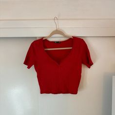 All Orders Ship Between 1-2 Business Days! Zara Red Ribbed Short Sleeve Crop Top Conditions: Like New/Clean Condition/Never Worn/No Holes/No Stains/No Pilling/No Fade Color: Red Size: Us L Category: Crop Top Product Type: Red Ribbed Short Sleeve Crop Top Material: 95% Cotton, 5% Elastane Sleeves: Short Occasion: Casual/Everyday Extra Details: This Red Crop Top Is Ribbed And Has A V Shaped Opening On The Neckline. Thanks For Visiting My Closet! When Making An Offer, Please Consider The Poshmark F Red Fitted V-neck Top, Zara Fitted V-neck Tops, Trendy Red V-neck Crop Top, Red Fitted V-neck Crop Top, Red Ribbed Fitted Crop Top, Zara Trendy V-neck Crop Top, Red Ribbed Summer Top, Red Ribbed Top For Summer, Fitted Ribbed Red Tops